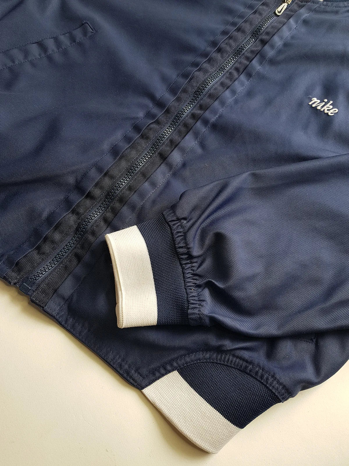 1990s Vintage Authentic Nike Workwear Vibes -  Bomber Style Track Jacket - Navy & Vintage White - Silver Hardware & Big Chunky Metal Zip - Embroidered Nike on the Chest - Elasticated Paneling on Neck Waist & Sleeves - Unworn Condition - Unisex Fit