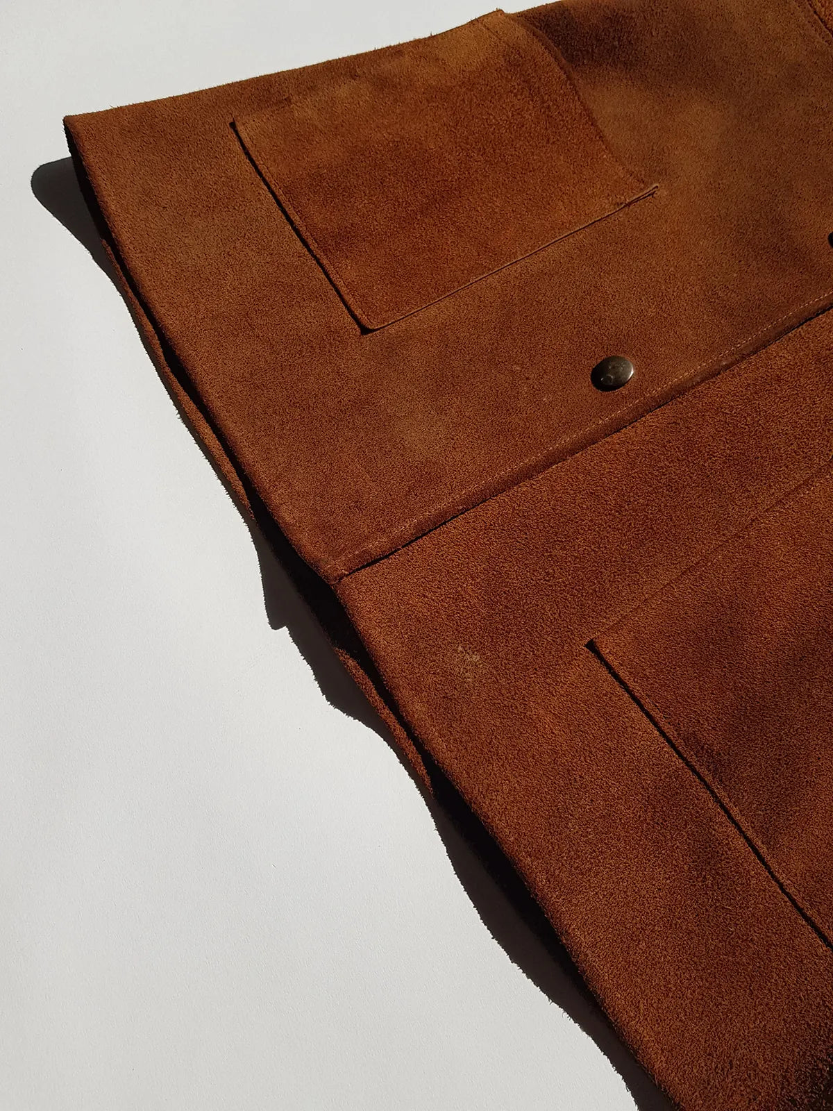 1970s genuine leather authentic vintage mini dress / vest in rich tobacco brown - metal pop buttons - belt loops - unbelievably cool