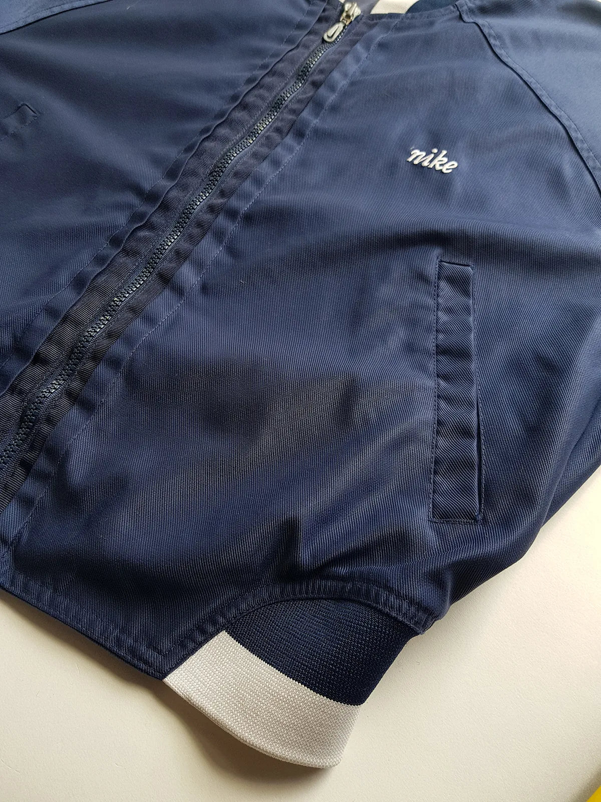 1990s Vintage Authentic Nike Workwear Vibes -  Bomber Style Track Jacket - Navy & Vintage White - Silver Hardware & Big Chunky Metal Zip - Embroidered Nike on the Chest - Elasticated Paneling on Neck Waist & Sleeves - Unworn Condition - Unisex Fit