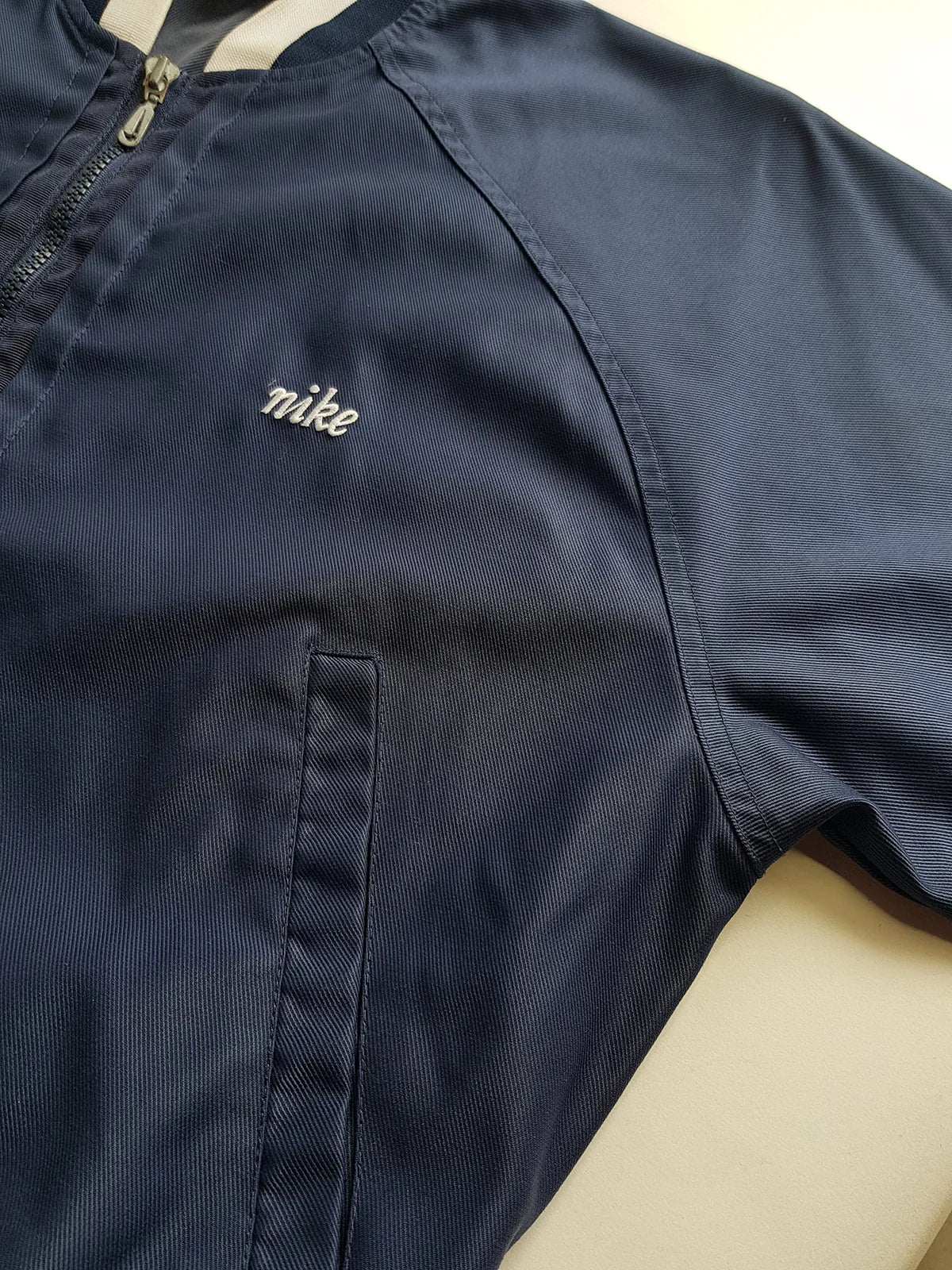 1990s Vintage Authentic Nike Workwear Vibes -  Bomber Style Track Jacket - Navy & Vintage White - Silver Hardware & Big Chunky Metal Zip - Embroidered Nike on the Chest - Elasticated Paneling on Neck Waist & Sleeves - Unworn Condition - Unisex Fit