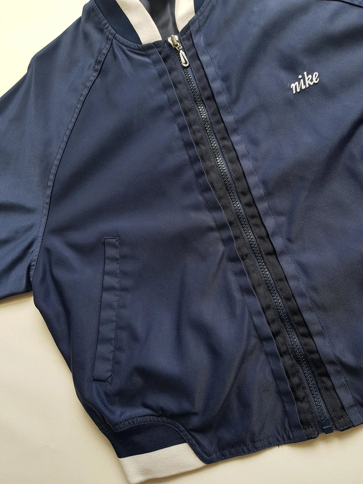 1990s Vintage Authentic Nike Workwear Vibes -  Bomber Style Track Jacket - Navy & Vintage White - Silver Hardware & Big Chunky Metal Zip - Embroidered Nike on the Chest - Elasticated Paneling on Neck Waist & Sleeves - Unworn Condition - Unisex Fit