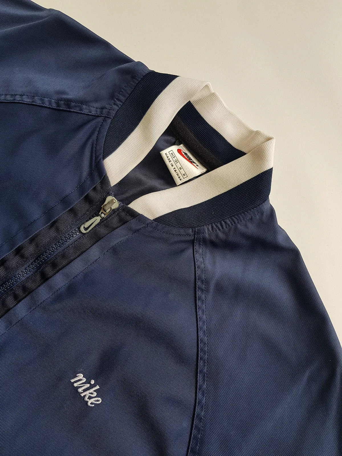 1990s Vintage Authentic Nike Workwear Vibes -  Bomber Style Track Jacket - Navy & Vintage White - Silver Hardware & Big Chunky Metal Zip - Embroidered Nike on the Chest - Elasticated Paneling on Neck Waist & Sleeves - Unworn Condition - Unisex Fit