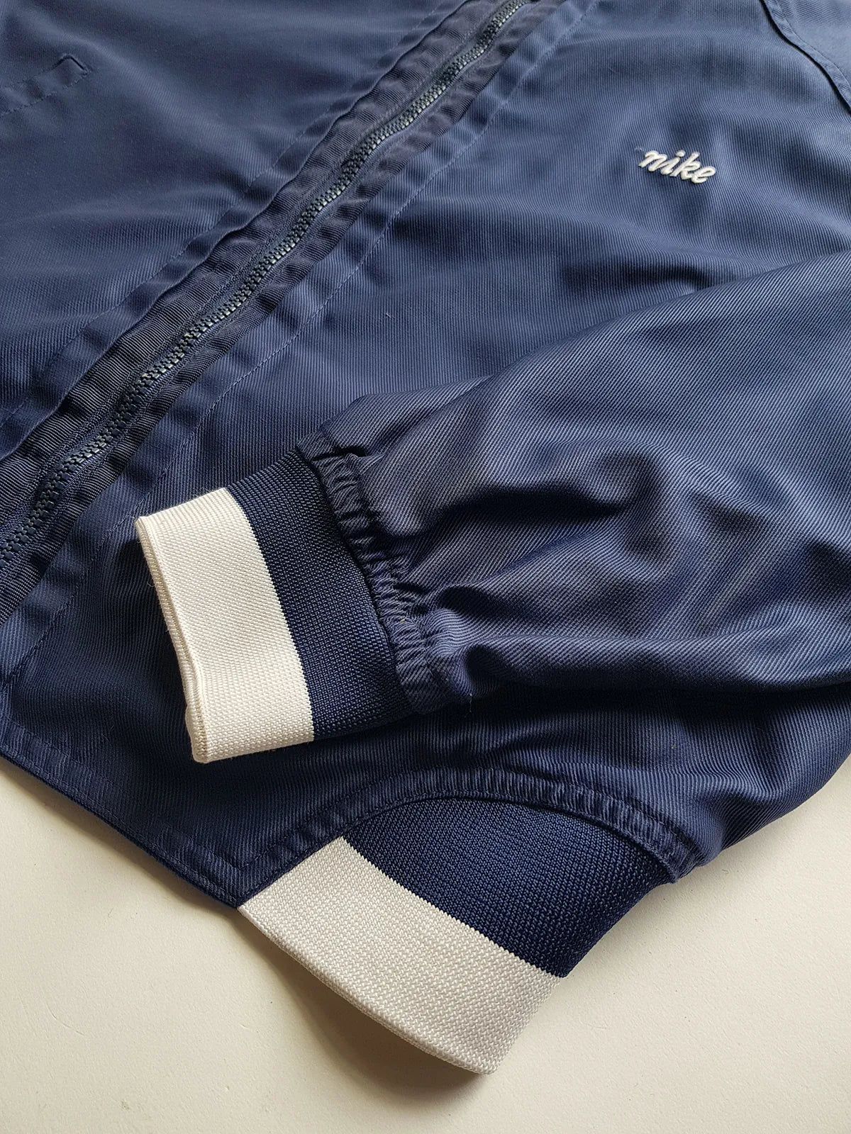 1990s Vintage Authentic Nike Workwear Vibes -  Bomber Style Track Jacket - Navy & Vintage White - Silver Hardware & Big Chunky Metal Zip - Embroidered Nike on the Chest - Elasticated Paneling on Neck Waist & Sleeves - Unworn Condition - Unisex Fit